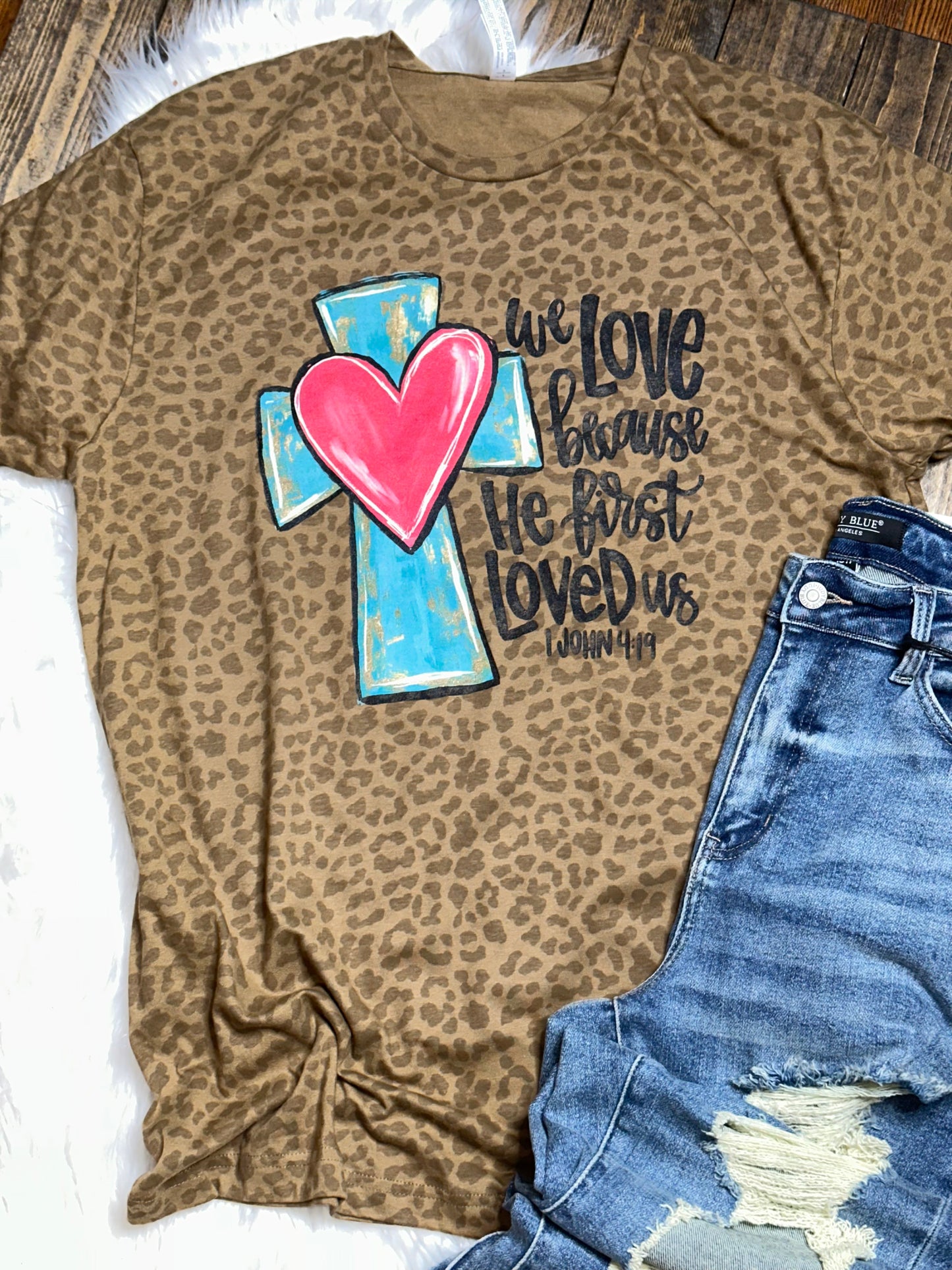 We Love Because He First Loved Us Brown Leopard Graphic Tee